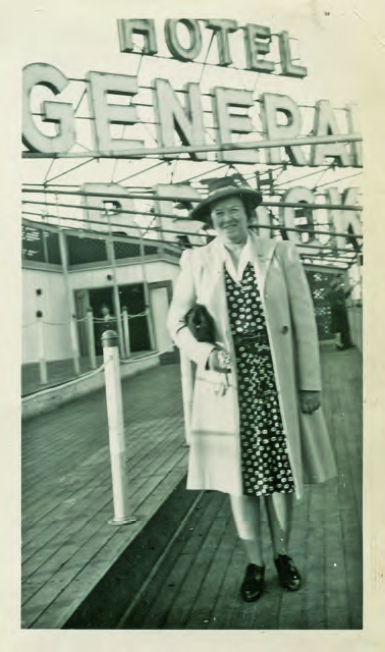 Woman posing by the Hotel General Brock sign in Niagara Falls
